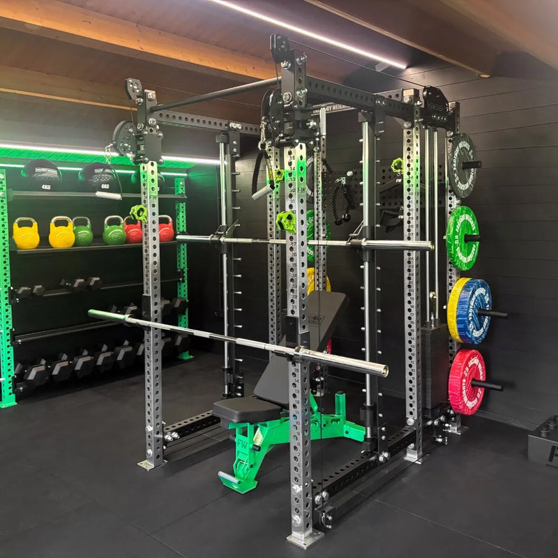 A heavy-duty, multi-functional home gym power rack equipped with a barbell, bench press, pulley system, and color-coded weight plates.