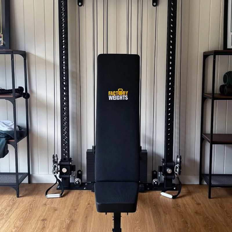 A black cable pulley weight bench machine with a padded backrest and footrest, featuring the 'FARMY WEIGHTS' logo in yellow and white on the backrest. 